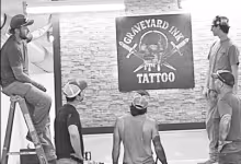 It was a group effort installing a Graveyard Ink sign in the new studio. From left to right are Cooper Blackledge, Scott Baughman, Corbyn Miller, Tisen Flatery (next to sign) and Chris Blackledge.