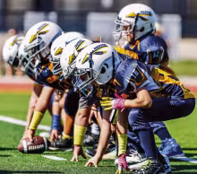 TODAY’S YOUTH LEAGUE PLAYERS, TOMORROW’S FRIDAY NIGHT STARS -- Council Grove’s 3rd and 4th graders are building the foundation for the future of Braves football. (Photo by Amber Weeks)