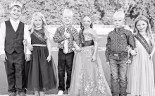 Six local youth served the USD 417 royalty well Friday night. The 2026 Fall Homecoming Little People were (L to R): Knute Fox, Adeline Johnson, Bodhi Green, Everleigh Mount, Mason Green and Kodi Romme. (Photo: Amber Frese)