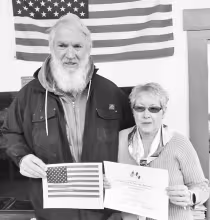 PRESENTED BRAILLE FLAG -- David Andres was a recent recipient of a braille flag from the Council Oak DAR flag chairman, Pat Schneider. Usually such flags are given to people that are blind and read braille so that they can read the Pledge of Allegiance. T