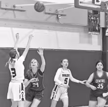 Herington High’s Sadie Haws (3) shoots a basket in Tuesday night’s home game against Centre. She scored eight points in the game, which was won by the Lady Railers, 34-20. Also pictured is Herington’s Ella Nelson (5) and Centre players Addison Kitzm