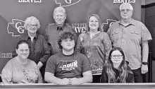 SIGNS LETTER OF INTENT -- Council Grove High School senior Gunner Gleason signed a National Letter of Intent to play football at Tabor College on Wednesday. There to witness the event were family members - Sitting (L to R): Cassie Kline, Gunner Gleason an