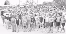 CG’S BACK! Council Grove Swim Club, coaches, club organizers and volunteers celebrate with a team photo on Saturday, June 14, after a successful Council Grove Invitational with top notch teams in attendance. There were nearly 90 swim events. Council Gro