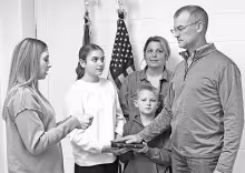NEW MAYOR SWORN IN - Council Grove Mayor Ryan McDonald was sworn into office at 4 p.m., Friday, January 9, 2026 at the Morris County Courthouse by Morris County Clerk Chelsey Schmidt (left). McDonald’s family - daughter Samantha, wife Amanda and son Eth