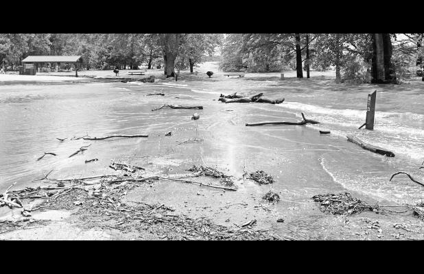 A Monday Council Grove Lake tour showed flooding behind the blockades in Richey Covey. White-capped waves were creating havoc with former picnic sites and young trees. Time will tell how much damage is done to the water-covered road.