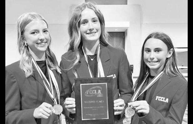 PLACING SECOND IN THE NATION with their project at the national FCCLA awards were USD 417 students (l to r) Madison Forge, Declan SanRomani and Ellie Palmquist.
