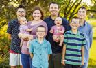 The McIver family has grown by two with the adoption of twins Hannah and Chloe. Pictured left to right, back row: Henry, Melinda, Callahan, Owen, middle: twins Hannah, Chloe, front row: Floyd, Noah.