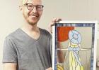 Adam Koci of Emporia holds “Prairie Stroll,” one of seven stained glass pieces now on display in the Council Grove Republican windows through Street Gallery KS, a division of the Bowers Center.
