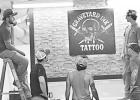 It was a group effort installing a Graveyard Ink sign in the new studio. From left to right are Cooper Blackledge, Scott Baughman, Corbyn Miller, Tisen Flatery (next to sign) and Chris Blackledge.