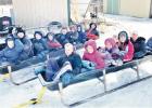 Feed bunk sledding is a family Christmas tradition at the Phipps household in Matfield Green. They enjoyed having snow (and Ice) this year. Sledders are back feed bunk: left to right Elijah Cahoone, Seth Peters, Titus Phipps, Caleb Peters, Isaac Cahoone, Through Your Eyes