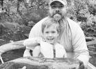 A CATFISHING FAMILY . . . Knute Fox, age 5, is following in his dad Matt’s footsteps with his love of fishing for big catfish in the Neosho River. (Photo: Brent Frazee)