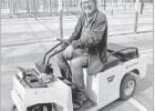 TODAY -- Eric Nelson navigates his many acres of greenhouses on a buggy.