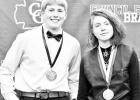 TOP GRADUATES -- Reid Buttrey (left) and Alex Priest graduated on Monday evening as the valedictorian and salutatorian of the Council Grove Junior High School eighth grade class. Sixty students were promoted during the ceremony at Braves Gym and will move TOP GRADUATES