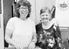 PRESENTS HEBRANK FAMILY MEMORABILIA -- Gena Rochat Reebs, granddaughter of the late Tillie (Hebrank) and Lindsay Rochat of rural Helmick, presents family memorabilia to Sharon Haun of the Morris County Historical Society last week. Reebs’ great-great gr PRESENTS HEBRANK FAMILY MEMORABILIA