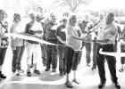 CUT THE RIBBON TO NEW FACILITY -- Morris County EMS held a ribbon cutting of their new facility 1447 KS 177, Council Grove on Saturday, Dr. Lora Siegle and Morris County Emergency Medical Services Director Dave Owen (center) did the honors while staff and CUT THE RIBBON TO NEW FACILITY