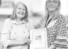Jan Koepke (left) presents her research project about seven black Civil War solders buried at the Dunlap Colored Cemetery to Morris County Historical Society representative Jan Kimbrell.