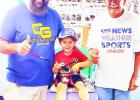 FISHING FOR SMILES -- Knute Fox (center) poses with his father Matt (left) and Phil Taunton of What’s In Outdoors. Knute was a winner of the Summer Long Family Fun Fishing Contest. Youth Fishing Events On Schedule As Summer Fishing Contest Closes