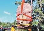 LIFTED FROM SPOT -- Tuesday, in preparation of the move to a temporary location in 2 weeks, the Kaw Nation’s prayer rock Iⁿ’zhúje’waxóbe was lifted from its long time resting spot in Lawrence. It will be placed in Allegawaho Memorial Heritage Pa Marion County Record Items Returned