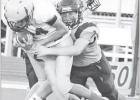 TACKLED -- Reid Buttrey makes one of his several tackles during the Junior High Braves football victory over Olpe last night. The win gives the JH Braves a 5-1 record on the season. (Photo by Amber Weeks) TACKLED -- Reid Buttrey makes one of his several tackles during the Junior High Braves football victory over Olpe last night