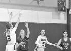Herington High’s Sadie Haws (3) shoots a basket in Tuesday night’s home game against Centre. She scored eight points in the game, which was won by the Lady Railers, 34-20. Also pictured is Herington’s Ella Nelson (5) and Centre players Addison Kitzm