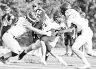 BRAVES SCRIMMAGE -- Kayden Schmidt (#25) carried the ball in the Council Grove High School Braves scrimmage Friday. Landon Dody (#12) is the one making the tackle. The Braves will be in action at home at 6 p.m., Friday during the Jamboree with Hillsboro, Article Image Alt Text