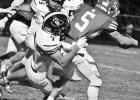TACKLED -- Braun Frye zeros in on Osage City’s receiver #5 and com- pletes a tackle for the Braves in Friday Night’s 15-8 loss to Osage City in the second round of playoffs